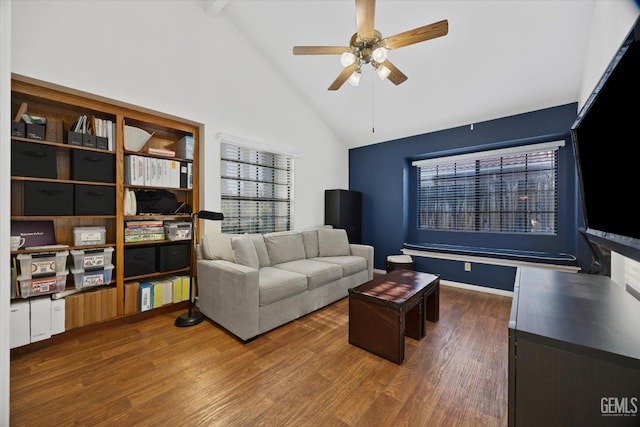 living room featuring a ceiling fan, high vaulted ceiling, wood finished floors, and beamed ceiling