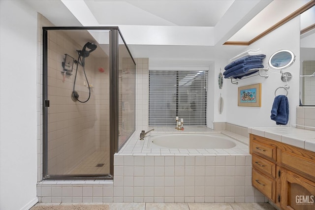 full bathroom featuring a garden tub, a shower stall, and vanity