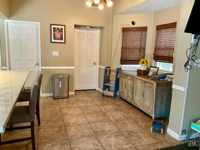2304 Mountain Oak Rd, Bakersfield, CA 93311 - kitchen featuring light tile patterned floors and baseboards