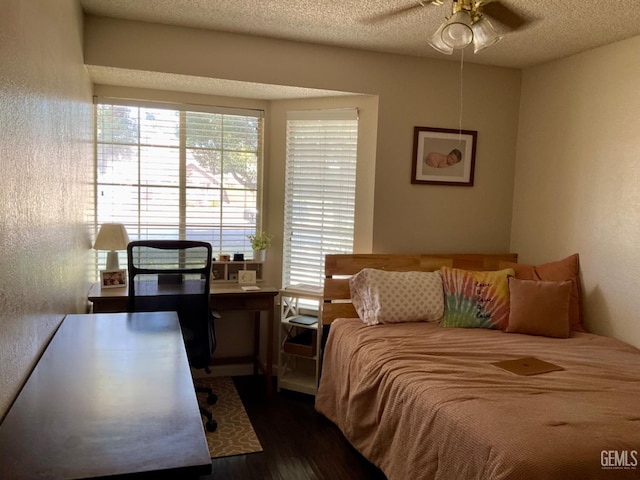 2304 Mountain Oak Rd, Bakersfield, CA 93311 - bedroom with wood finished floors, multiple windows, and a textured ceiling
