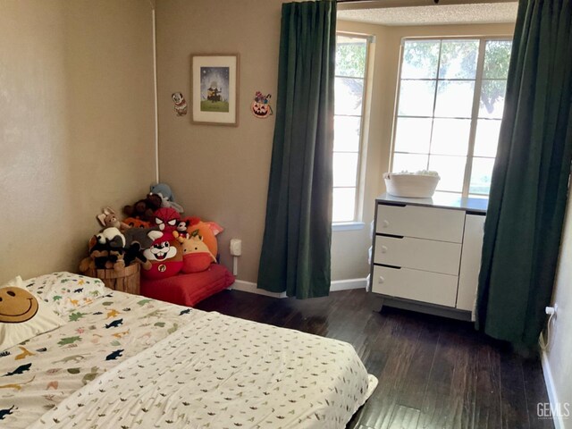 2304 Mountain Oak Rd, Bakersfield, CA 93311 - bedroom featuring multiple windows and dark wood finished floors