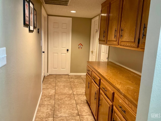 2304 Mountain Oak Rd, Bakersfield, CA 93311 - hall featuring light tile patterned floors and a textured ceiling
