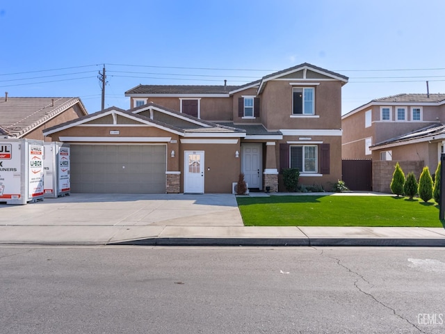 view of front of home featuring a garage, concrete driveway, a front lawn, and stucco siding