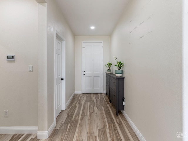 interior space with light wood-style flooring and baseboards