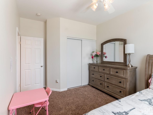 bedroom featuring ceiling fan, a closet, carpet flooring, and baseboards