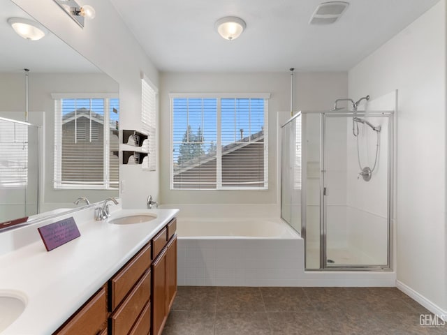 full bathroom with double vanity, visible vents, a bath, a shower stall, and a sink