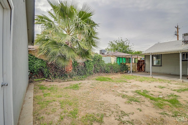 view of yard featuring a patio area and fence