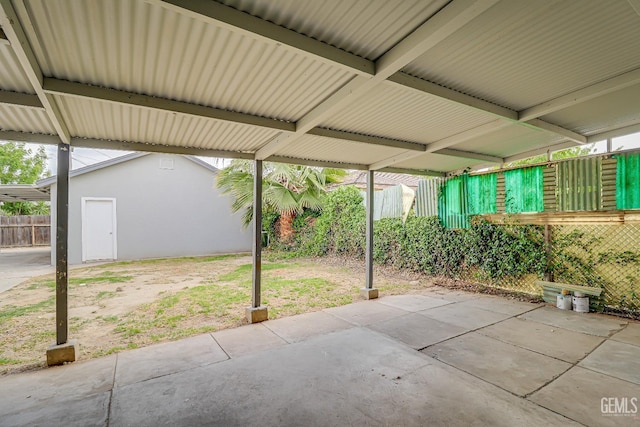 view of patio featuring fence