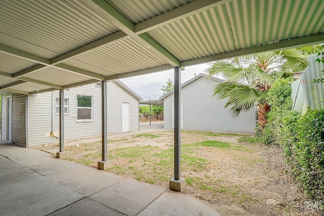 view of patio / terrace with an outbuilding