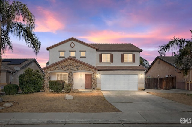 view of front of property with central AC and a garage