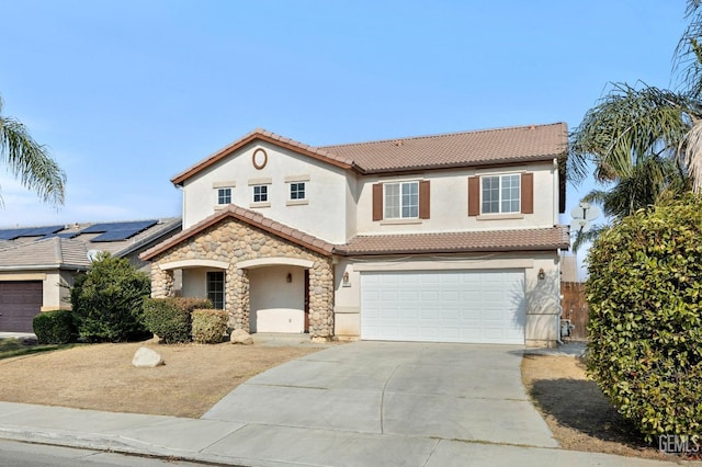 view of front of home featuring a garage and solar panels