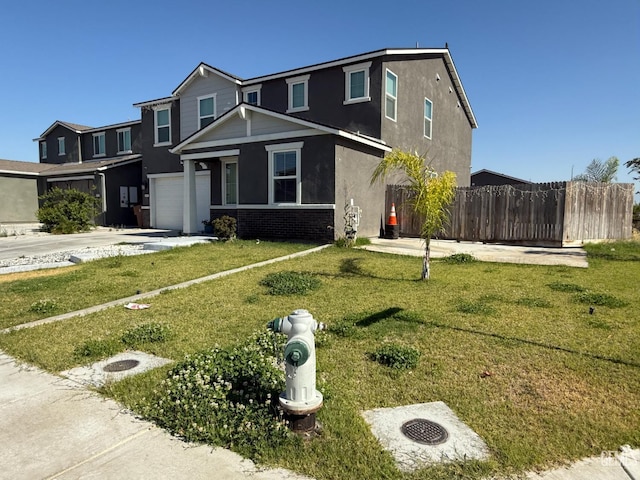 6009 Cardano Ave, Bakersfield, CA 93313 - view of front of property with a garage, stucco siding, concrete driveway, and brick siding
