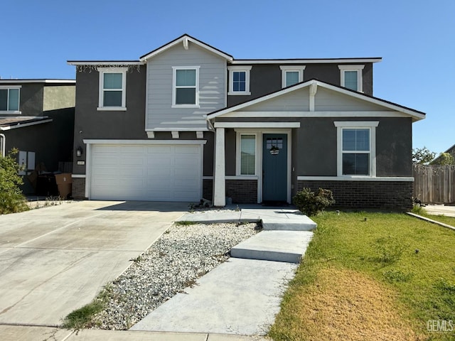 6009 Cardano Ave, Bakersfield, CA 93313 - view of front of property with brick siding, a garage, concrete driveway, and stucco siding
