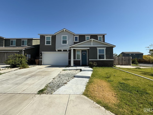 6009 Cardano Ave, Bakersfield, CA 93313 - view of front of property with driveway, an attached garage, and brick siding
