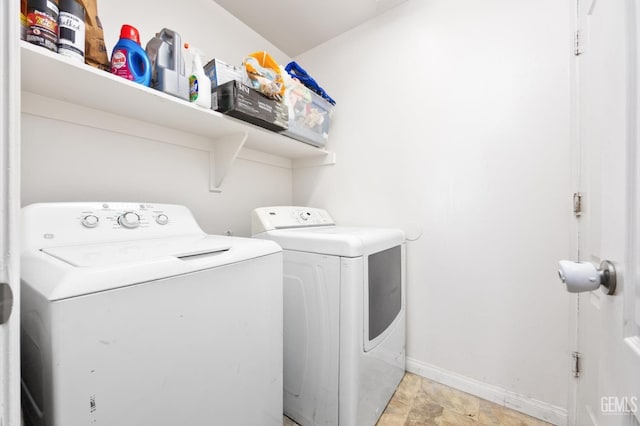 clothes washing area featuring washing machine and dryer