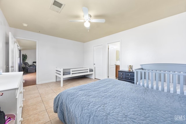 tiled bedroom with ceiling fan