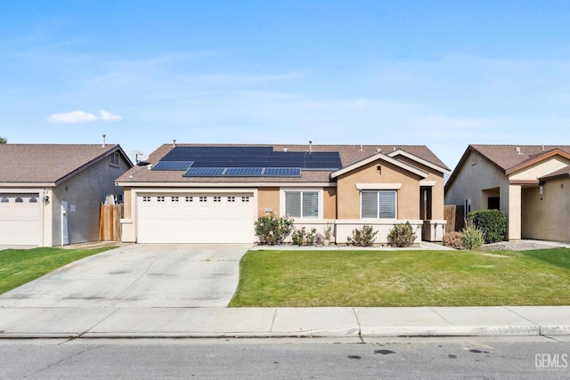 single story home featuring a garage, a front lawn, and solar panels