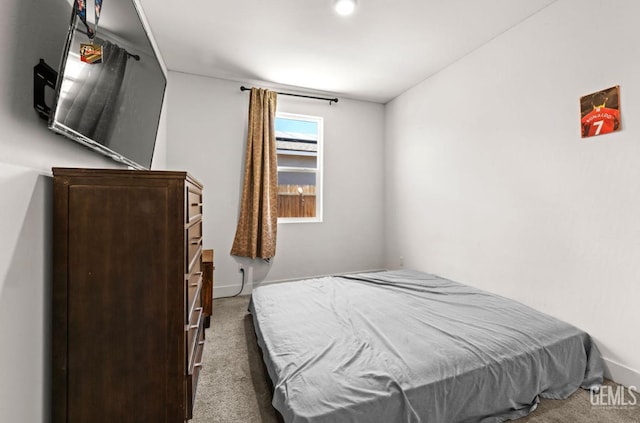6607 Wind Wolfs Ln, Bakersfield, CA 93313 - carpeted bedroom with baseboards