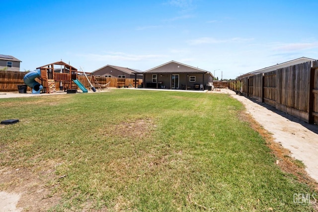 6607 Wind Wolfs Ln, Bakersfield, CA 93313 - fenced backyard with a playground