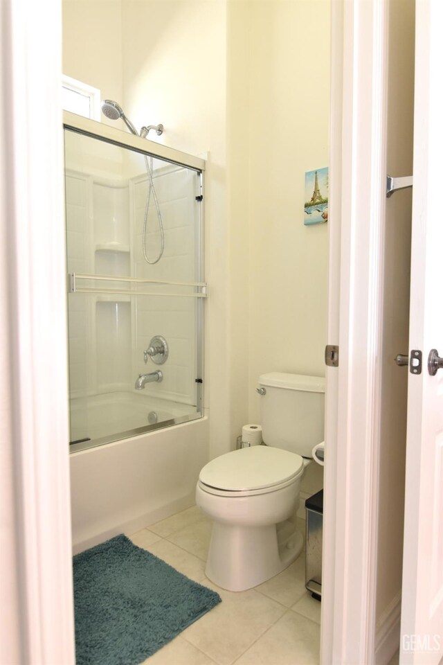 5712 Wisteria Valley Rd, Bakersfield, CA 93306 - bathroom with tile patterned flooring, toilet, and combined bath / shower with glass door
