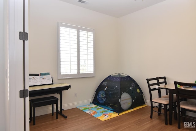 5712 Wisteria Valley Rd, Bakersfield, CA 93306 - miscellaneous room featuring wood finished floors and baseboards