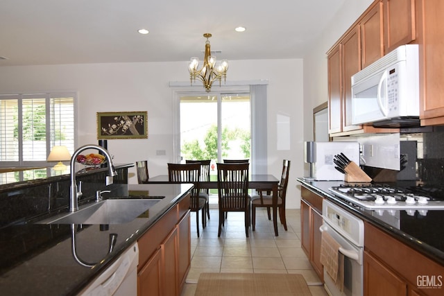 5712 Wisteria Valley Rd, Bakersfield, CA 93306 - kitchen with white appliances, a sink, a chandelier, recessed lighting, and light tile patterned floors