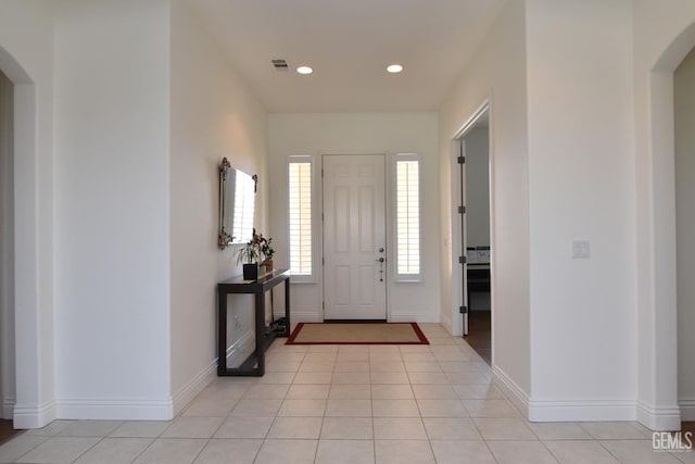 5712 Wisteria Valley Rd, Bakersfield, CA 93306 - foyer entrance with arched walkways, recessed lighting, baseboards, and light tile patterned floors