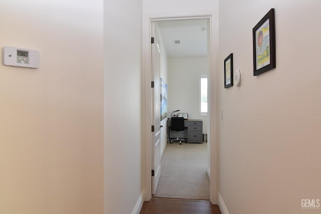 5712 Wisteria Valley Rd, Bakersfield, CA 93306 - hall featuring a desk, baseboards, and wood finished floors