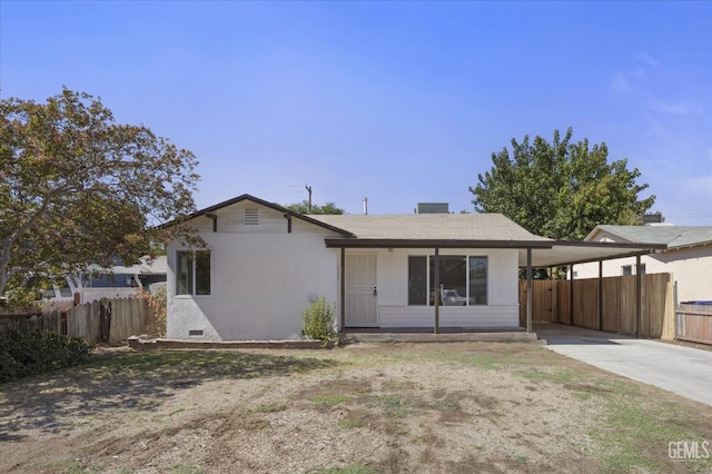 164 Rodriguez Ave, Shafter, CA 93263 - rear view of property with an attached carport and driveway