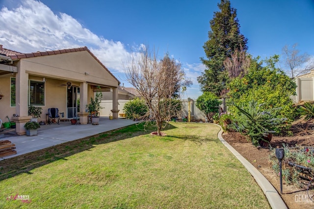 view of yard with a fenced backyard, a patio area, and ceiling fan