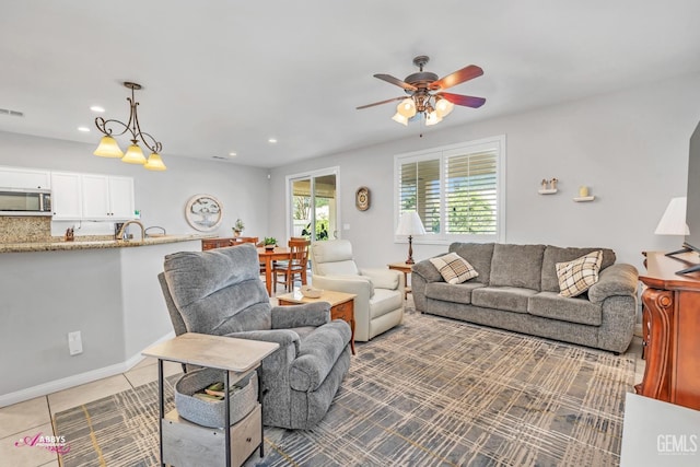 living room featuring light tile patterned floors, visible vents, recessed lighting, and a ceiling fan