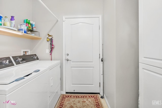 laundry room featuring baseboards, laundry area, and washing machine and clothes dryer