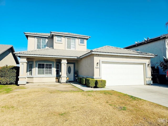 view of front of house featuring a garage and a front yard