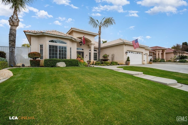 mediterranean / spanish-style house featuring a garage and a front yard