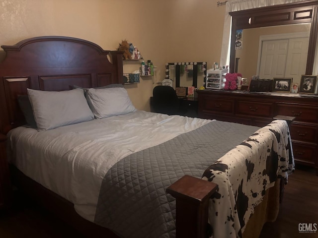 bedroom featuring dark wood-style floors