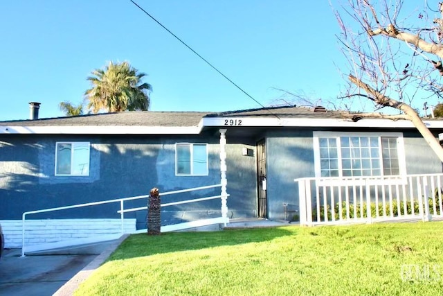 2912 Wilson Rd, Bakersfield, CA 93304 - view of front of property with a front yard and roof with shingles