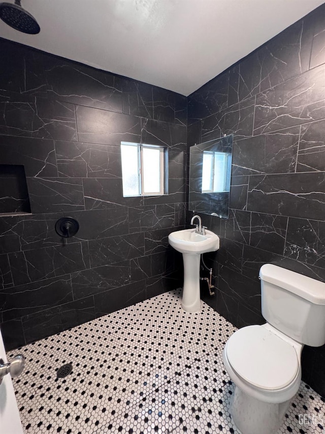 2912 Wilson Rd, Bakersfield, CA 93304 - bathroom featuring tile walls, tiled shower, and tile patterned floors
