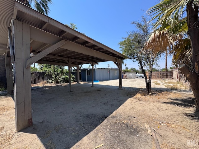 2912 Wilson Rd, Bakersfield, CA 93304 - view of yard featuring a carport