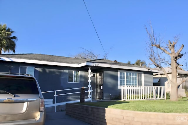 2912 Wilson Rd, Bakersfield, CA 93304 - view of front of home featuring stucco siding and a shingled roof
