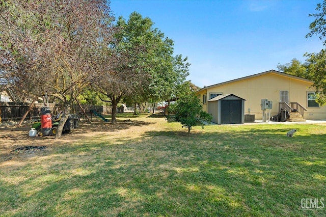 22940 Fast Ct, Bakersfield, CA 93314 - view of yard with a storage shed and a playground