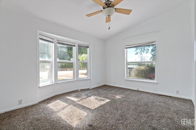 22940 Fast Ct, Bakersfield, CA 93314 - spare room featuring vaulted ceiling, carpet flooring, healthy amount of natural light, and a ceiling fan