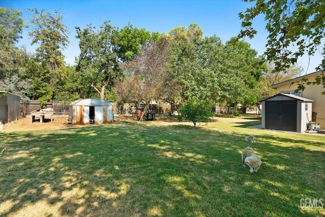 22940 Fast Ct, Bakersfield, CA 93314 - fenced backyard featuring a storage shed and view of scattered trees