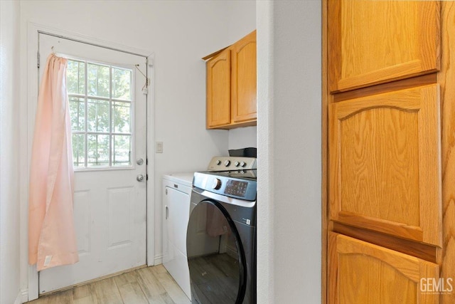 22940 Fast Ct, Bakersfield, CA 93314 - laundry area with cabinet space, washing machine and dryer, and light wood-type flooring