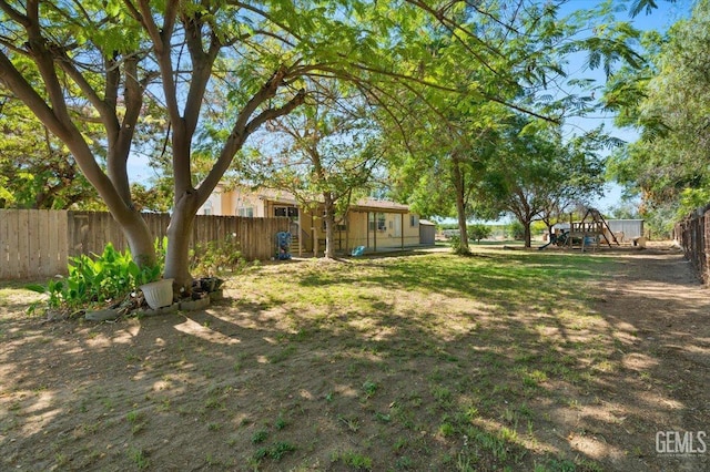 22940 Fast Ct, Bakersfield, CA 93314 - fenced backyard with a playground
