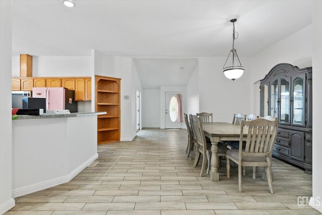 22940 Fast Ct, Bakersfield, CA 93314 - dining space with light wood-type flooring and baseboards
