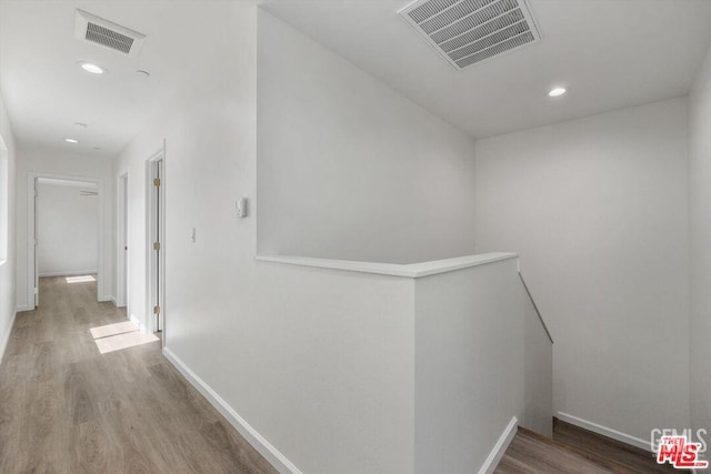 hallway featuring hardwood / wood-style floors