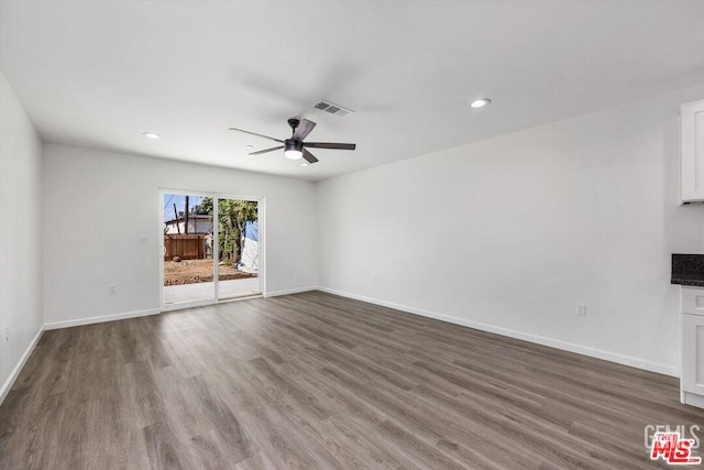 unfurnished living room featuring hardwood / wood-style floors and ceiling fan