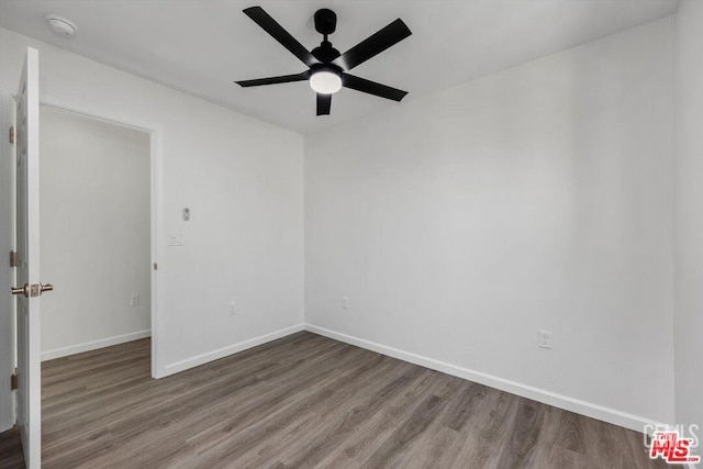 unfurnished room with ceiling fan and hardwood / wood-style floors