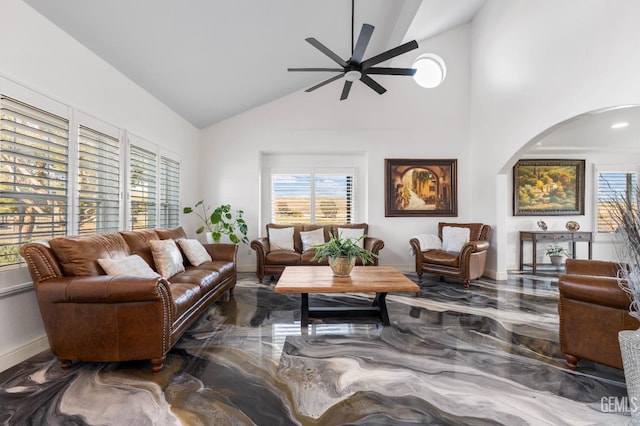 living area with high vaulted ceiling, baseboards, marble finish floor, and ceiling fan