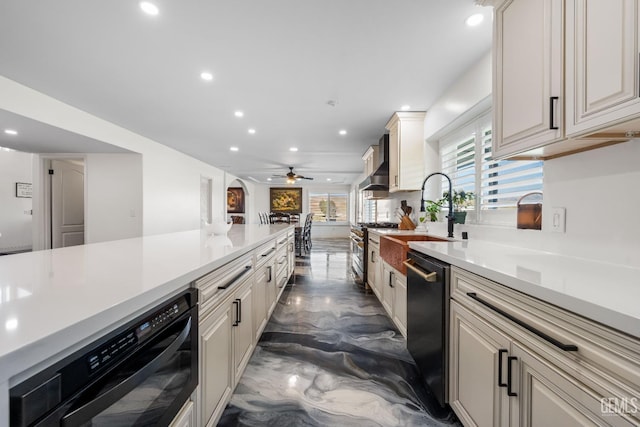 kitchen featuring a sink, recessed lighting, light countertops, dishwashing machine, and ceiling fan